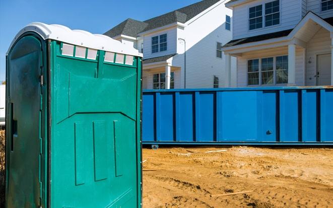 portable toilet and dumpster at a construction site project in Bradenton FL